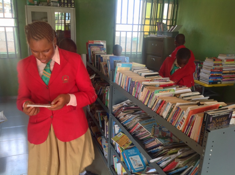 students reading in the library of Goodnews international school